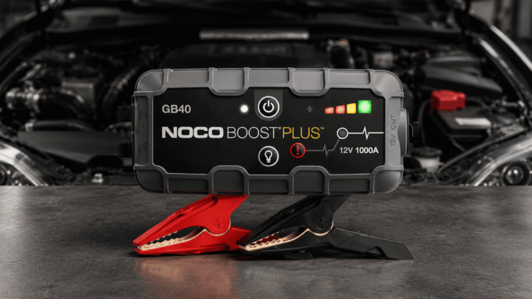 NOCO Boost Plus GB40 lithium jump starter review showing portable jump starter with clamps for a car battery